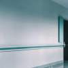 Empty,Hospital,Hallway,With,Handrails,,A,Doorway,,And,A,Trash