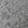 close up photo of waters on grey surface
