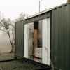 modern container home in misty outdoor setting