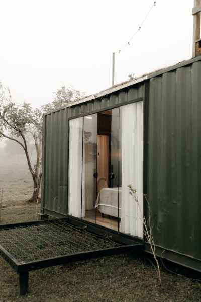 modern container home in misty outdoor setting