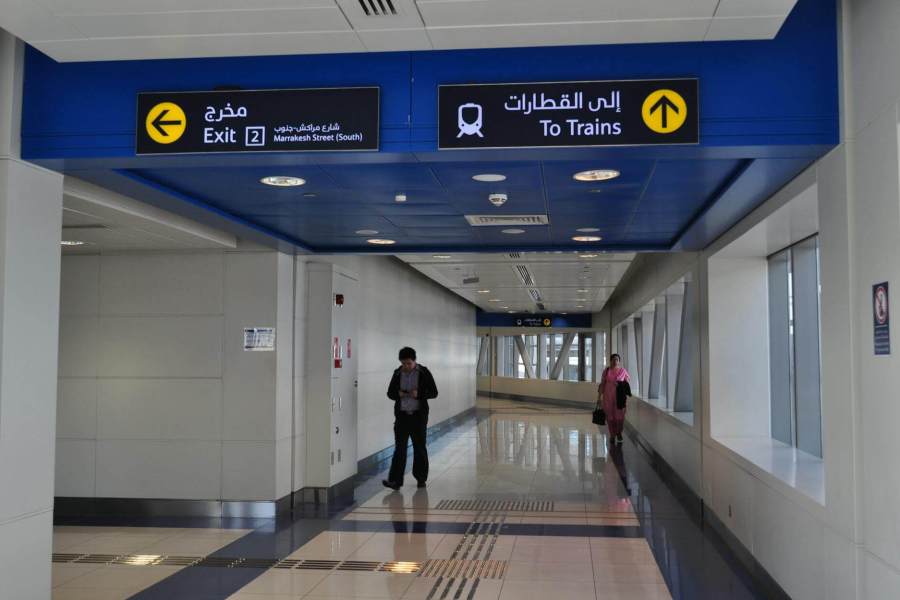 dubai train station hallway with signage