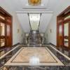 interior of hallway with marble floor in luxury apartment
