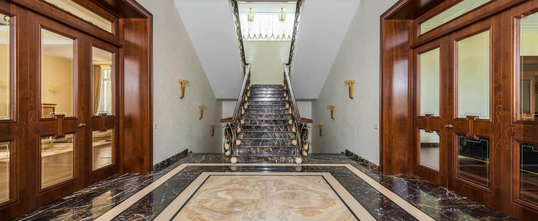 interior of hallway with marble floor in luxury apartment