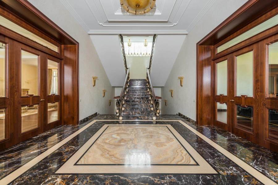 interior of hallway with marble floor in luxury apartment