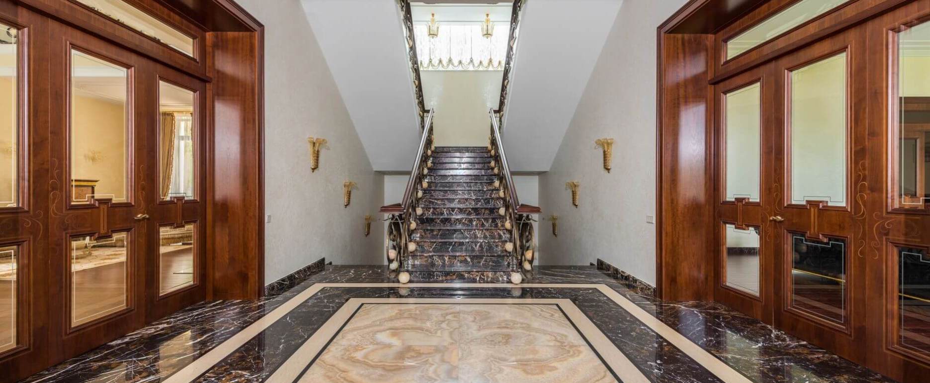 interior of hallway with marble floor in luxury apartment