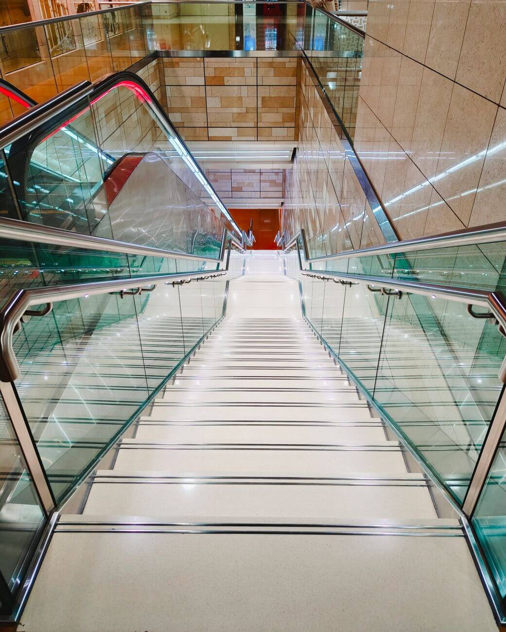 modern indoor staircase with glass railings