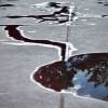abstract reflection in a puddle on concrete surface